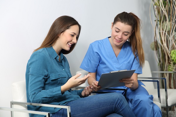 Woman talking with medical professional